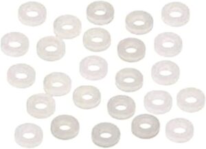 Transparent plastic washers arranged in a pattern.